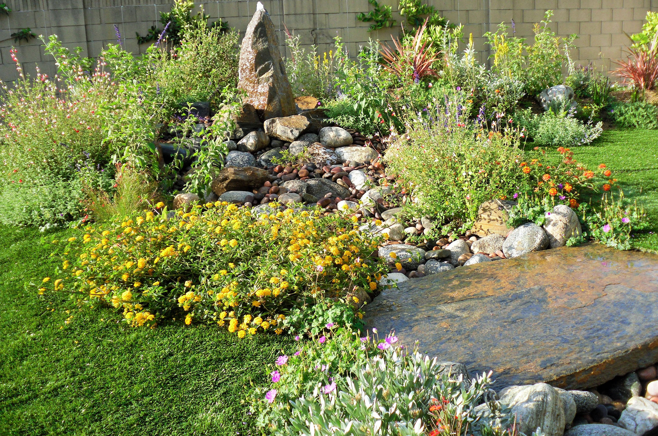 https://atmospherelandscapes.com/wp-content/uploads/2015/05/CERRITOS-Fountain-and-Dry-Streambed-1.jpg